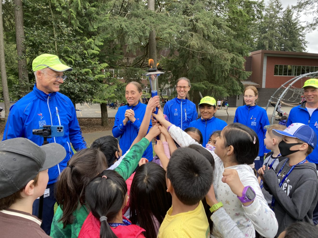 Running Club: Peace Torch Visit and Marathon Accomplishments